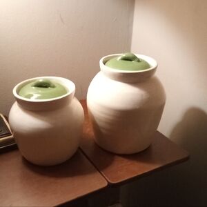 Elegant White Ceramic Jars with Green Lids